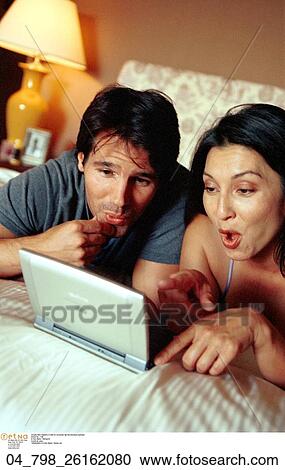 Technology, Inside, Surprise, Brunette, Couple, At Home View Large Photo Image Stock Image - Technology, Inside, Surprise, Brunette, Couple, At Home. Fotosearch