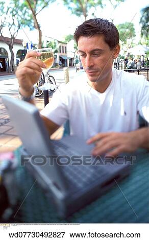 thirties, working on holiday, typing, vertical image, workaholic, technology, abroad View Large Photo Image Stock Photo - thirties, working on holiday, typing, vertical image, workaholic, technology, abroad. Fotosearch