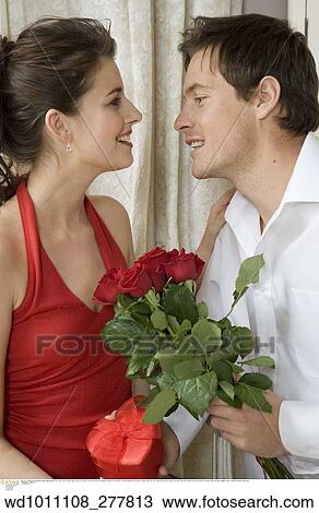 twenties, vertical image, under 35, Valentines, Valentines present, touching, at home View Large Photo Image Stock Image - twenties, vertical image, under 35, Valentines, Valentines present, touching, at home. Fotosearch