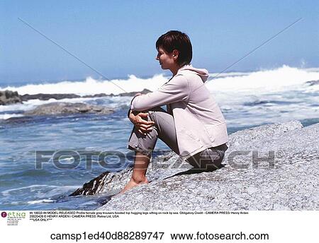 Stock Photo - under 35, Beach, brunette hair, emotions, european descent. Fotosearch