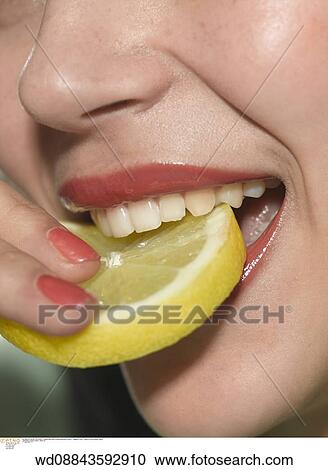 Stock Image - under 35, studio, sour, solo, smiling. Fotosearch