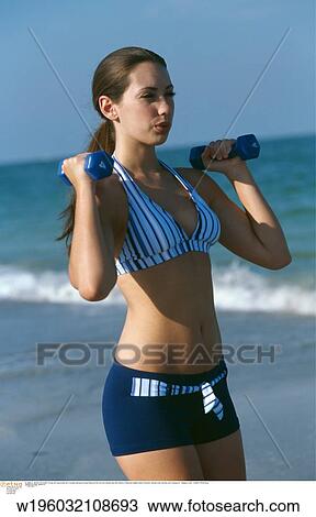 Stock Image - under 35, tanned, swimwear, summer. Fotosearch