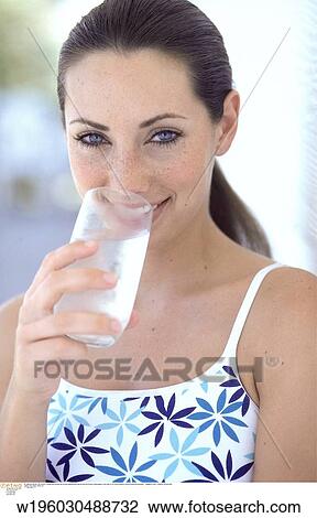 Stock Image - under 35, thirsty, summer, straight to camera, spring. Fotosearch