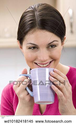 Stock Photography - under 35, twenties, thirties, teatime, tea break, solo. Fotosearch