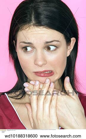 Stock Image - vertical image, unhappy, under 35, twenties, thirties, studio. Fotosearch