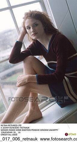 Stock Image - Woman, Inside, Pensive, Indoors, Brunette, Sitting. Fotosearch