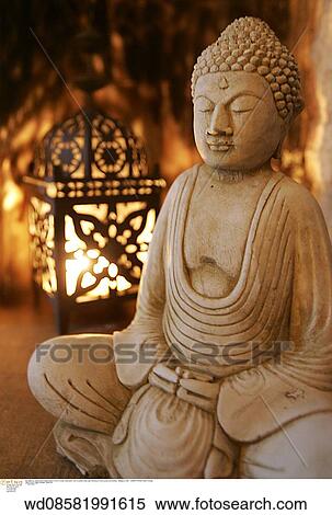 Stock Photography - wood sculpture, still life, religious icon, oriental influence, lighting. Fotosearch