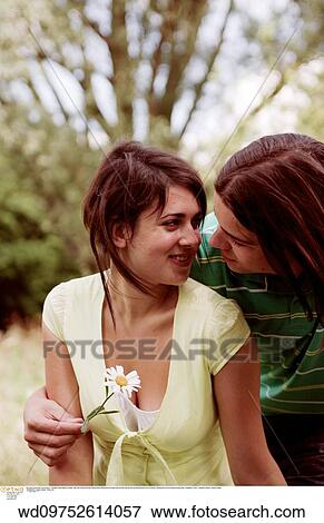 Stock Photo - young love, teenager, teenage couple, teenage, summer. Fotosearch