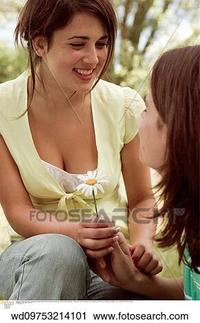 Stock Image - young love, very happy, teenager, teenage couple, teenage. Fotosearch
