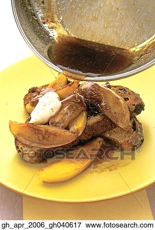 Stock Photo - Caramelised mango on fruit bread toast.. Fotosearch