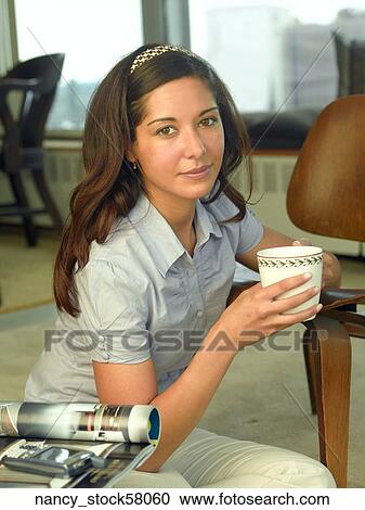 Ethnic Girl wearing a blue button down shirt View Large Photo Image Stock Image - Ethnic Girl wearing a blue button down shirt. Fotosearch