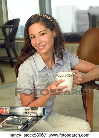 Ethnic Girl wearing a blue button down shirt View Large Photo Image Stock Photo - Ethnic Girl wearing a blue button down shirt. Fotosearch