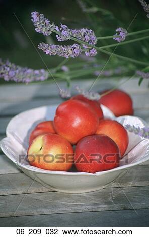 Stock Image - Food still life outside fruit red dich bowl nectarines nectarine. Fotosearch