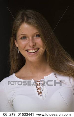 Head and shoulders front view portrait young woman long blonde hair looking at camera smiling View Large Photo Image Stock Image - Head and shoulders front view portrait young woman long blonde hair looking at camera smiling. Fotosearch