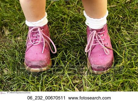 little girl wearing shoes
