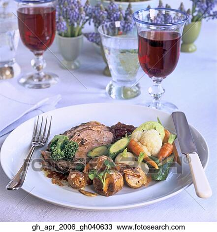 Roast spring lamb with fresh mint dressing and vegetables. Glasses of red wine in the background and purple flowers. Cutlery on the side of plate. View Large Photo Image Stock Image - Roast spring lamb with fresh mint dressing and vegetables. Glasses of red wine in the background and purple flowers. Cutlery on the side of plate.. Fotosearch