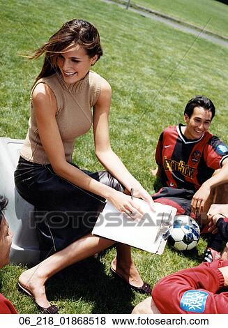 woman portrait field summer team soccer football man sport happy smiling writing spring sitting down season lawn journalist job discussion View Large Photo Image Stock Photo - woman portrait field summer team soccer football man sport happy smiling writing spring sitting down season lawn journalist job discussion. Fotosearch