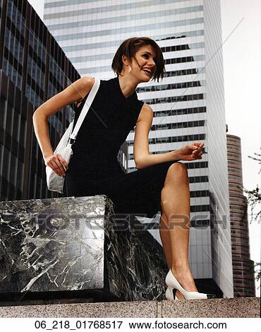 woman portrait work outside happy smiling summer sitting suit black skirt tank top vest handbag street high heels city business bag building View Large Photo Image Stock Photo - woman portrait work outside happy smiling summer sitting suit black skirt tank top vest handbag street high heels city business bag building. Fotosearch