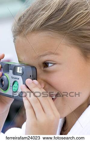 A young girl taking pictures with a disposable camera. View Large Photo Image Stock Image - A young girl taking pictures with a disposable camera.. Fotosearch
