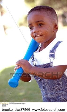 African American little boy playing baseball outside in denim jump suit View Large Photo Image Stock Photograph - African American little boy playing baseball outside in denim jump suit. Fotosearch