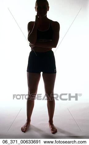Body imageSilhoutte of a woman in cropped top and shorts standing with legs apar View Large Photo Image Stock Image - Body imageSilhoutte of a woman in cropped top and shorts standing with legs apar . Fotosearch