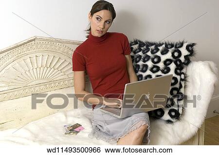 Brunette female with hair in a pony tail View Large Photo Image Stock Photograph - Brunette female with hair in a pony tail. Fotosearch