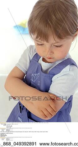 Stock Image -  Child / toddler / girl with cut lip. Fotosearch