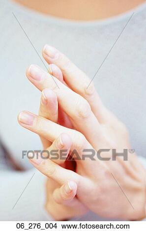 Picture -  EmotionsCropped shot of a woman with her hands together. Fotosearch