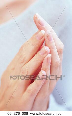 Stock Photography -  EmotionsCropped shot of a woman with her hands together . Fotosearch