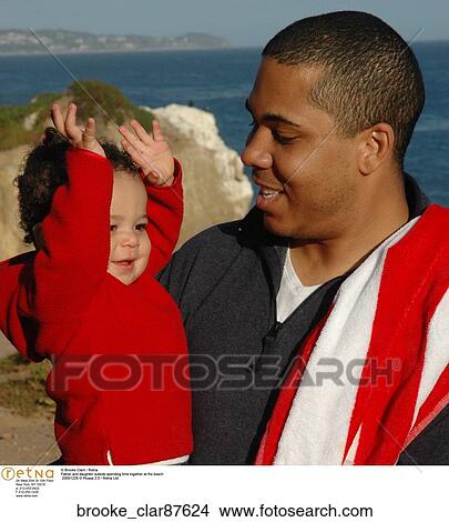 Father and daughter outside spending time together at the beach View Large Photo Image Picture - Father and daughter outside spending time together at the beach. Fotosearch