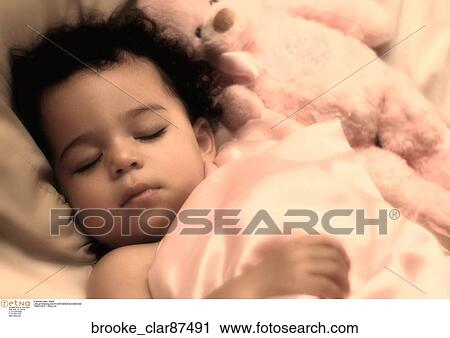 Little girl sleeping peaceful with blanket and teddy bear View Large Photo Image Stock Image - Little girl sleeping peaceful with blanket and teddy bear. Fotosearch