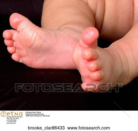 Stock Image - Portrait of a infant bare feet. Fotosearch