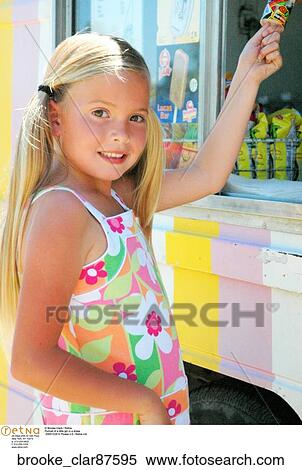 Portrait of a little girl in a dress View Large Photo Image Stock Photography - Portrait of a little girl in a dress . Fotosearch