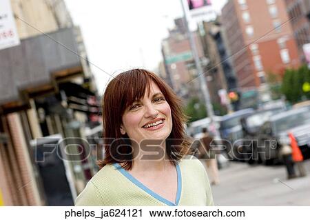 Portrait of a woman in her 30's outdoors. View Large Photo Image Stock Image - Portrait of a woman in her 30's outdoors. . Fotosearch