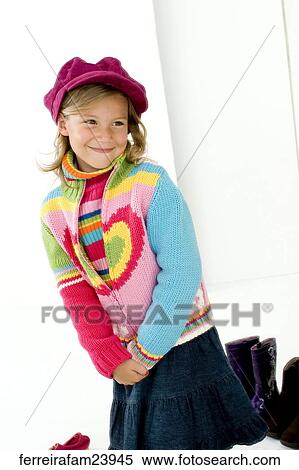 Portrait of a young girl wearing a hat posing with colorful clothing View Large Photo Image Stock Photography - Portrait of a young girl wearing a hat posing with colorful clothing. Fotosearch