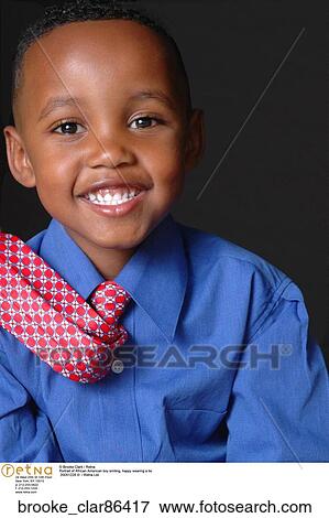 Portrait of African American boy smiling" View Large Photo Image Stock Photo - Portrait of African American boy smiling". Fotosearch