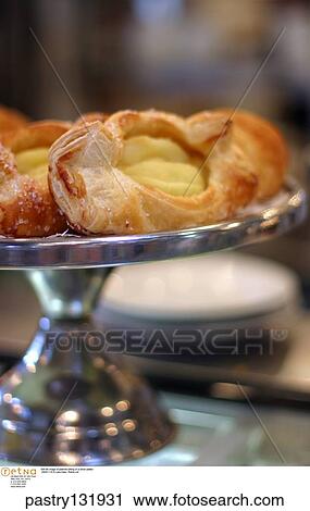 Still life image of pastries sitting on a silver platter. View Large Photo Image Stock Image - Still life image of pastries sitting on a silver platter.. Fotosearch