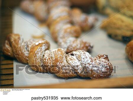 Stock Photography -  Still life image of pastry/ pastries dusted in powdered sugar. . Fotosearch
