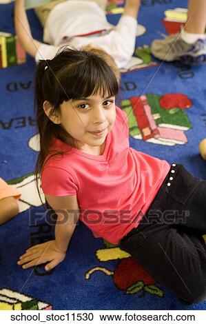 Stock images of science related topics Girl student wearing a pink shirt and sitting in the libray View Large Photo Image Stock Image - Stock images of science related topics Girl student wearing a pink shirt and sitting in the libray. Fotosearch
