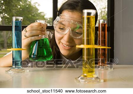 Stock images of science related topics Girl in chemistry class with liquids View Large Photo Image Stock Image - Stock images of science related topics Girl in chemistry class with liquids. Fotosearch