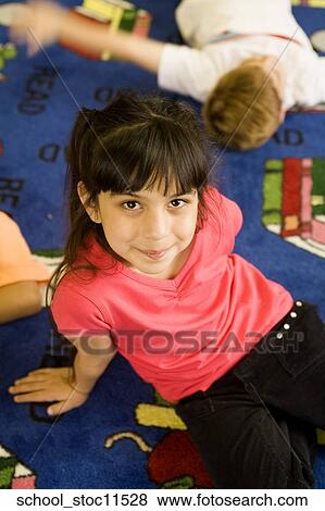 Stock images of science related topics Girl student wearing a pink shirt and sitting in the libray View Large Photo Image Stock Photo - Stock images of science related topics Girl student wearing a pink shirt and sitting in the libray. Fotosearch