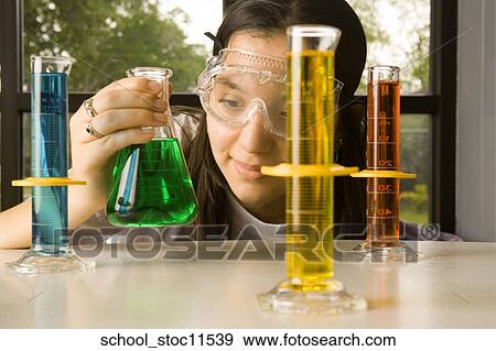 Stock images of science related topics Girl in chemistry class with liquids View Large Photo Image Stock Photo - Stock images of science related topics Girl in chemistry class with liquids. Fotosearch