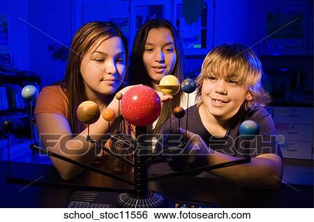 Stock images of science related topics student working on their solar system school project. View Large Photo Image Stock Photograph - Stock images of science related topics student working on their solar system school project.. Fotosearch