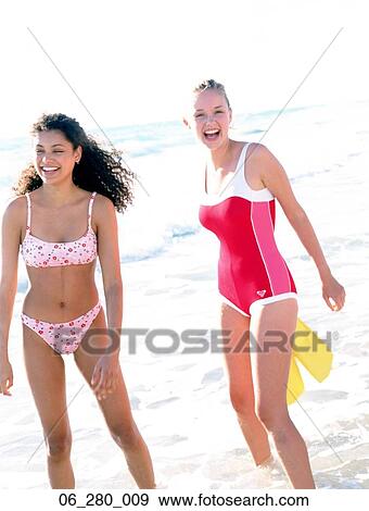 Summer beautyTwo women frolicking on the sea View Large Photo Image Stock Photo - Summer beautyTwo women frolicking on the sea . Fotosearch