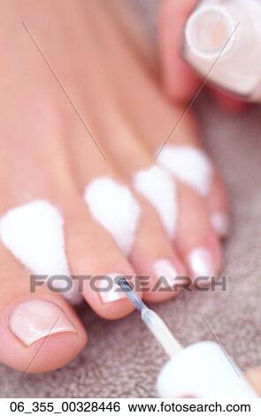 Woman BeautyCropped image of a woman painting her toenails View Large Photo Image Stock Photograph - Woman BeautyCropped image of a woman painting her toenails . Fotosearch
