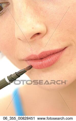 Woman BeautyCropped image of woman applying make-up View Large Photo Image Stock Image - Woman BeautyCropped image of woman applying make-up . Fotosearch