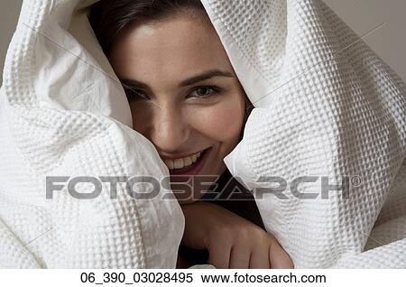 Woman in BedClose up of a woman in bed wrapped up in a white duvet View Large Photo Image Stock Photography - Woman in BedClose up of a woman in bed wrapped up in a white duvet . Fotosearch