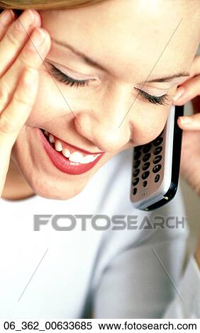 Stock Photography -  Woman on the phoneClose up of a woman on the phone looking happy . Fotosearch