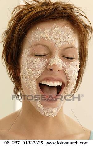 Front view head and shoulders young woman with short hair in a face mask with eyes closed mouth open shouting View Large Photo Image Stock Photography - Front view head and shoulders young woman with short hair in a face mask with eyes closed mouth open shouting. Fotosearch