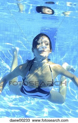 beauty, dark hair, bubble, brown hair, aquatic sport View Large Photo Image Stock Image - beauty, dark hair, bubble, brown hair, aquatic sport. Fotosearch